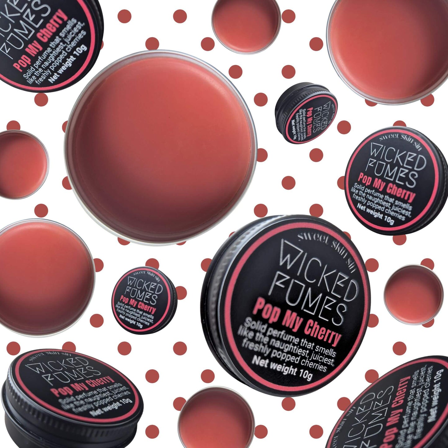 bunch of pop my cherry tins floating against cherry coloured polka dots