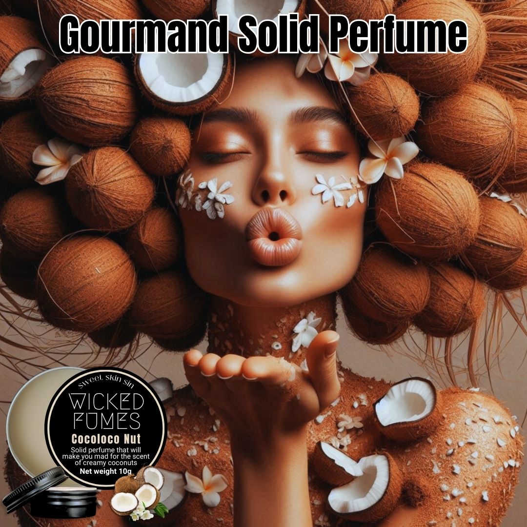woman wearing bunch of coconuts on her head with coconut scattered all over her body, she is blowing a kiss. the heading says gourmand solid perfume and there is a tin of wicked fumes cocoloco nut coconut scented solid perfume showing