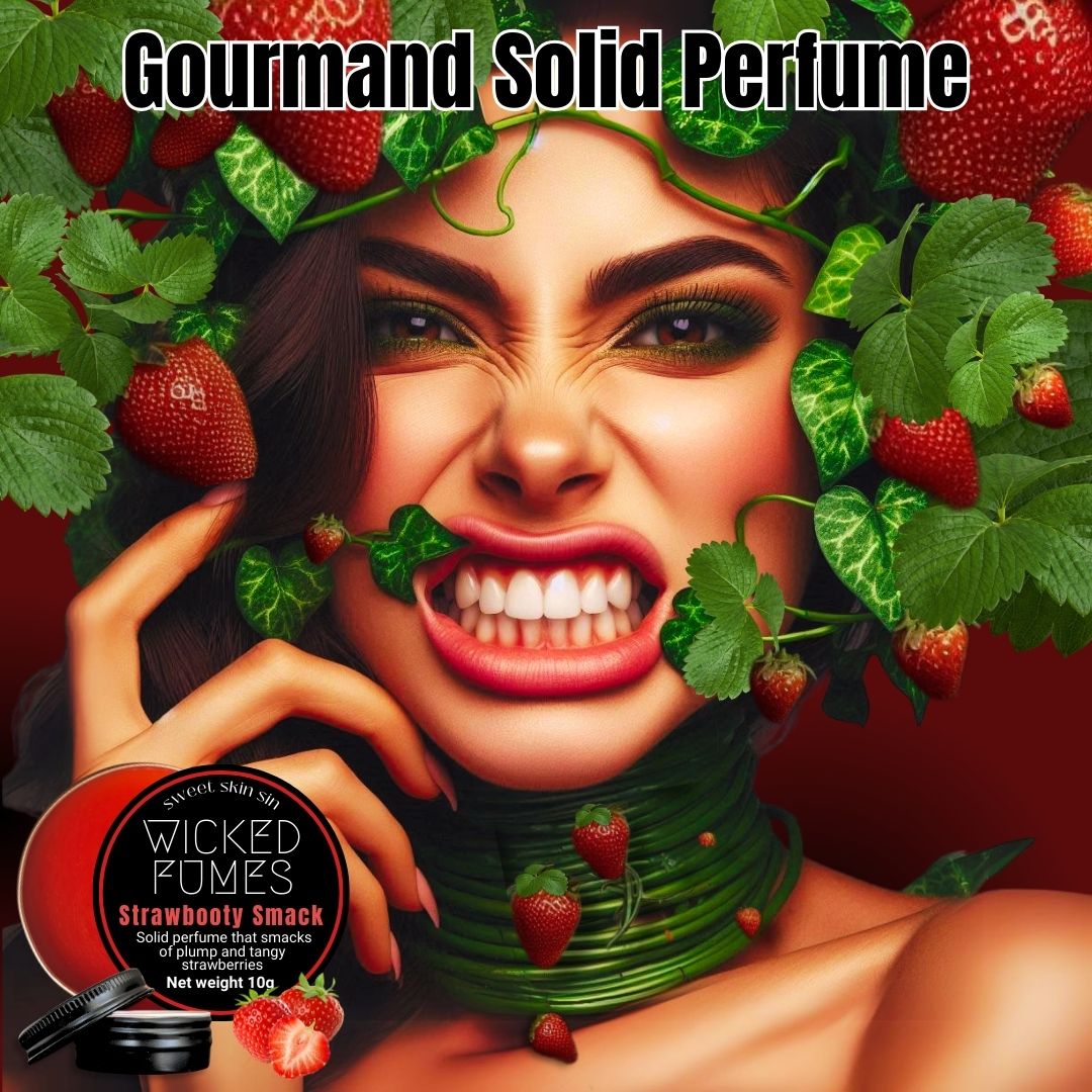 woman with strawberry vines and strawberries wrapped around her head and neck baring her teeth. the title says gourmand solid perfume and a tin of Wicked Fumes Strawbooty Smack strawberry scented solid perfume is being shown